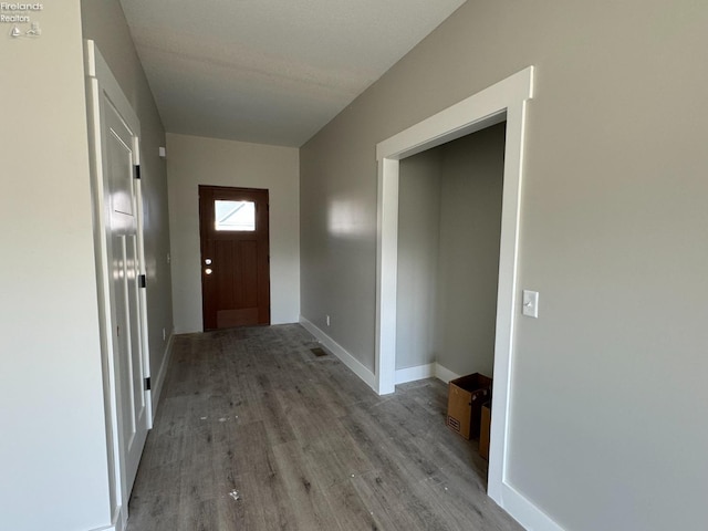 foyer entrance with light hardwood / wood-style floors