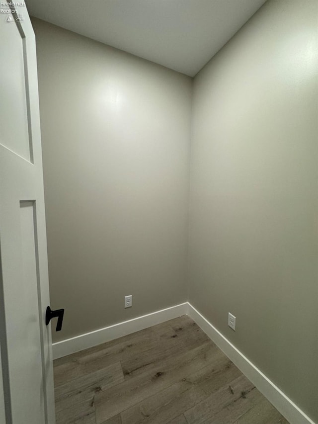 10 Eagle View Dr, Monroeville, OH 44847 - laundry room featuring wood finished floors and baseboards