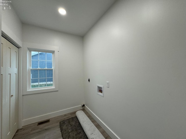 10 Eagle View Dr, Monroeville, OH 44847 - washroom with electric dryer hookup, wood finished floors, hookup for a washing machine, baseboards, and recessed lighting