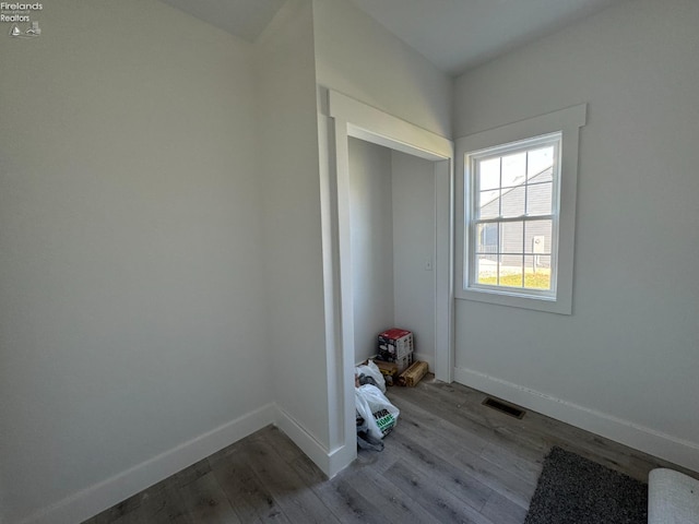 spare room with hardwood / wood-style floors