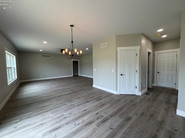 10 Eagle View Dr, Monroeville, OH 44847 - unfurnished room featuring a chandelier, baseboards, wood finished floors, and recessed lighting