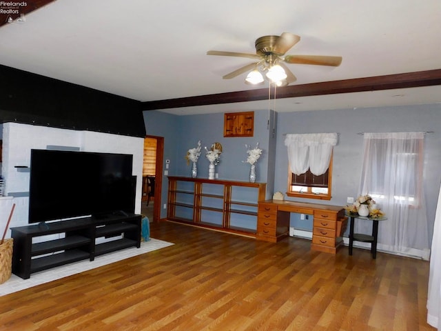 living room featuring a baseboard heating unit, hardwood / wood-style flooring, and ceiling fan