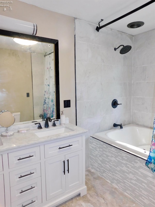 bathroom with shower / bath combo with shower curtain and vanity