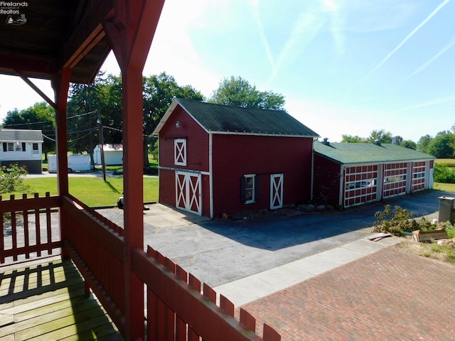 exterior space with an outbuilding and a lawn