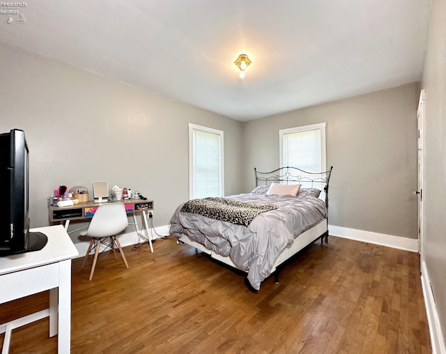 bedroom featuring dark wood-type flooring