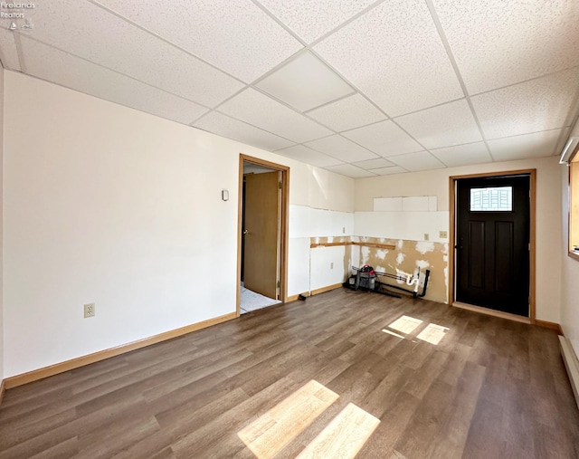 foyer with hardwood / wood-style flooring and a paneled ceiling