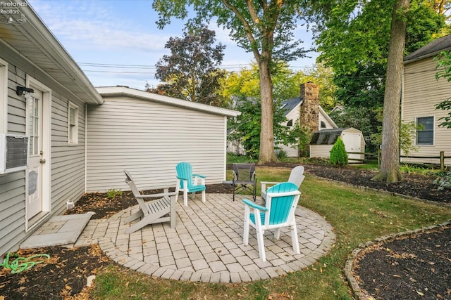 view of patio with a storage unit