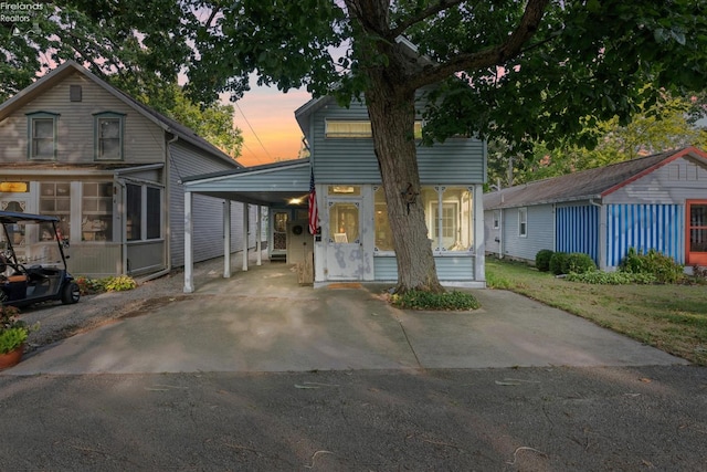 view of front facade with a carport