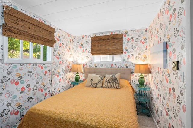 bedroom featuring carpet and multiple windows