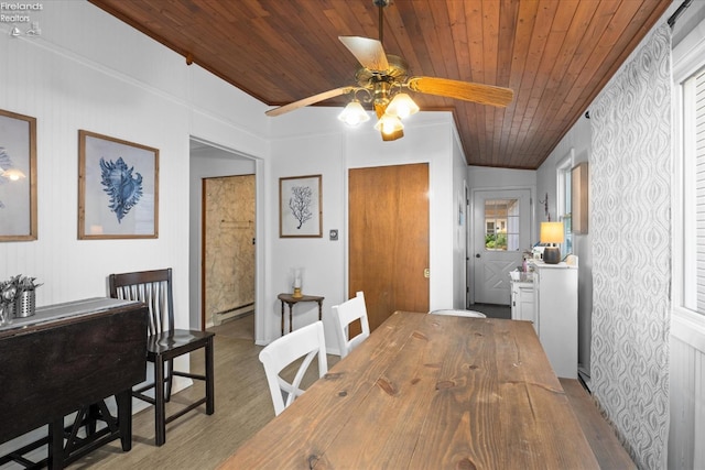 dining space with a baseboard heating unit, wood ceiling, light hardwood / wood-style flooring, and ceiling fan