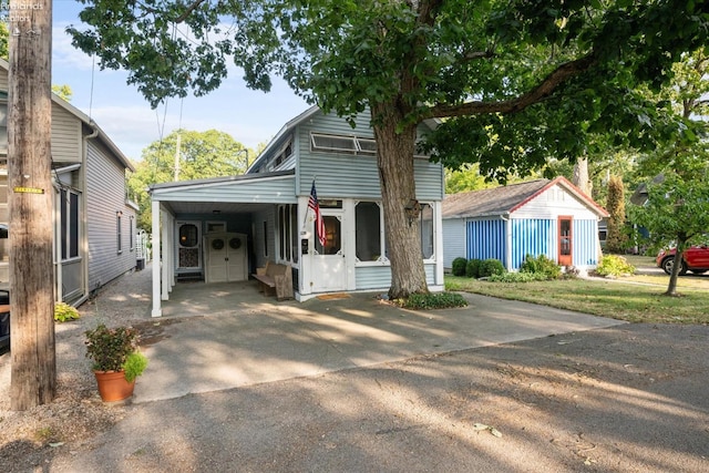 front facade with a carport