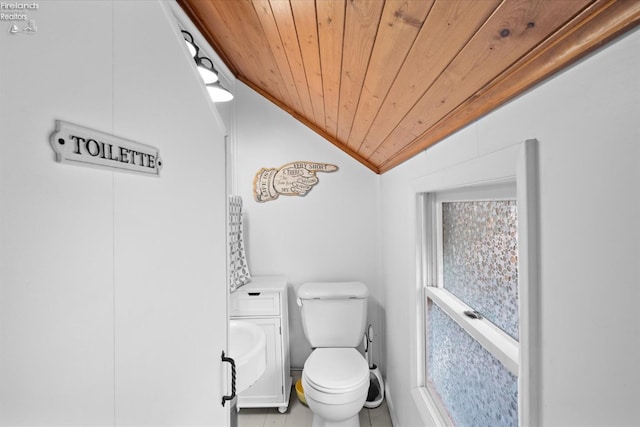 bathroom with wooden ceiling, lofted ceiling, toilet, and a wealth of natural light