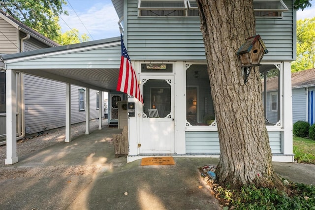 exterior space with a carport