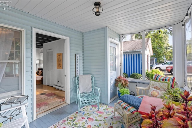 view of patio featuring a baseboard heating unit