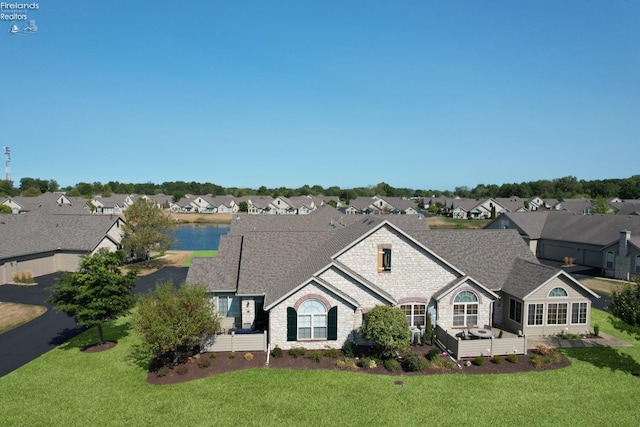 ranch-style house with a front lawn