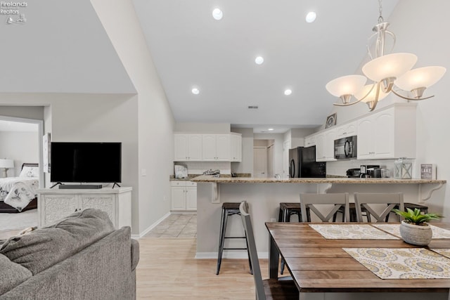 dining room with light hardwood / wood-style floors