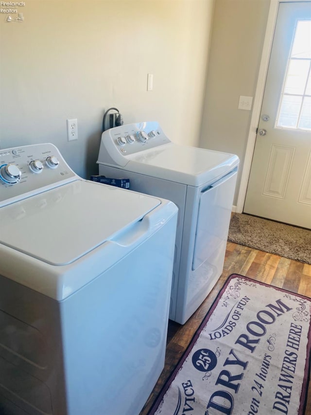 laundry room with dark hardwood / wood-style floors and independent washer and dryer