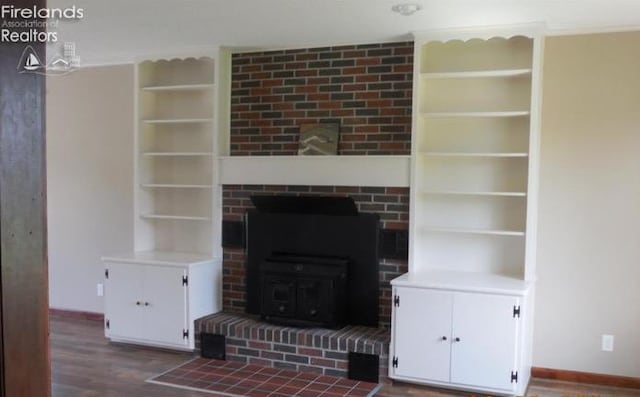 unfurnished living room featuring wood-type flooring and a fireplace