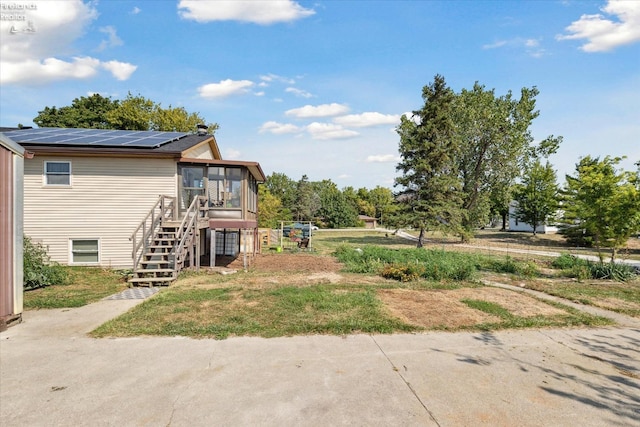 view of yard featuring a sunroom