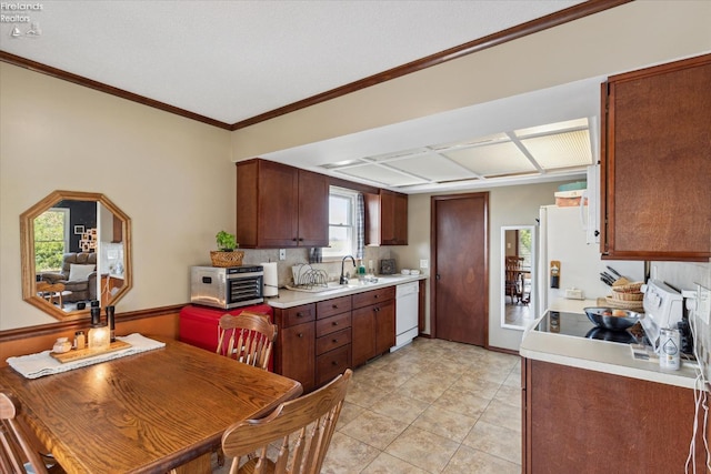 kitchen featuring tasteful backsplash, sink, crown molding, white dishwasher, and light tile patterned floors