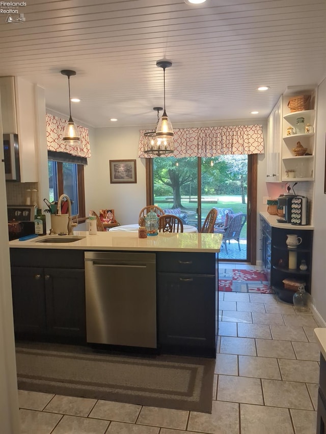 kitchen featuring stainless steel dishwasher, wood ceiling, sink, pendant lighting, and white cabinets