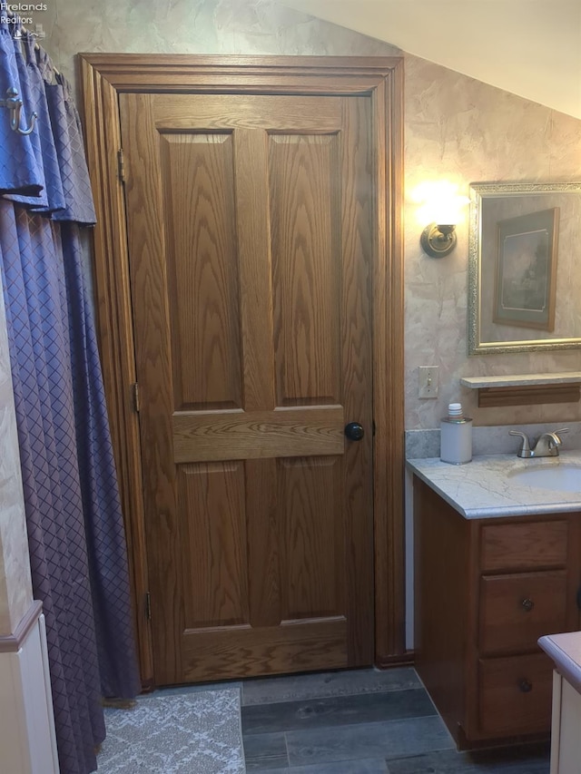 bathroom featuring hardwood / wood-style flooring and vanity