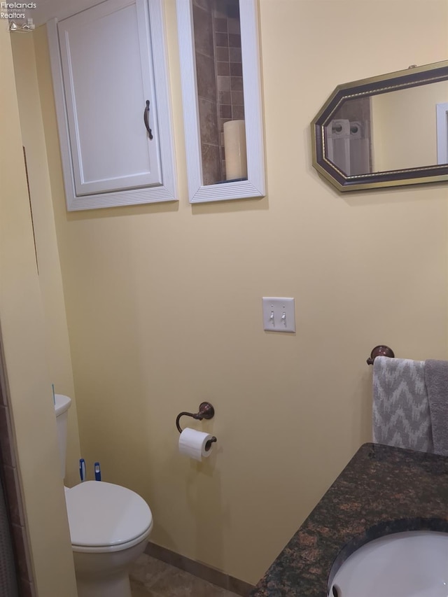 bathroom featuring toilet and sink