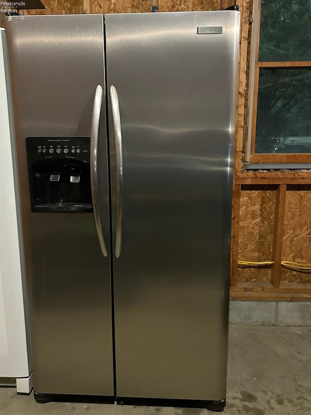 details featuring stainless steel refrigerator with ice dispenser