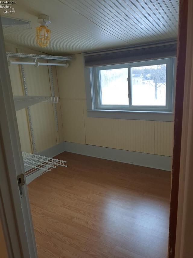 unfurnished bedroom with hardwood / wood-style flooring