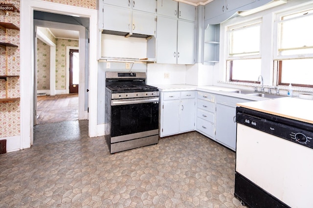 kitchen featuring white cabinetry, dishwasher, sink, and stainless steel range