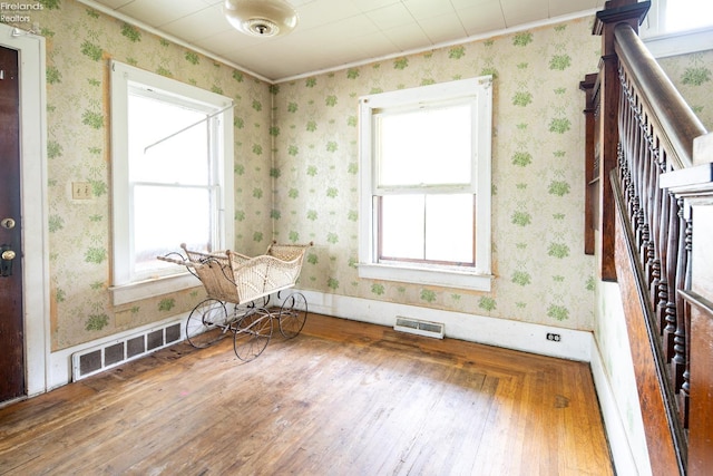 unfurnished room featuring hardwood / wood-style flooring