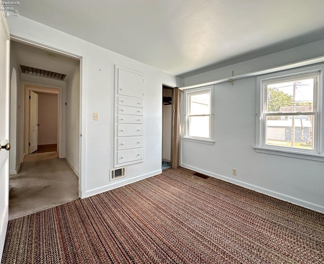 unfurnished bedroom with carpet flooring