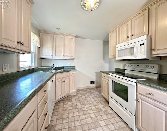 kitchen with white appliances and sink