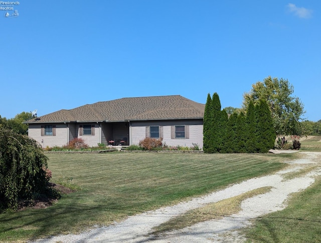 ranch-style house with a front lawn