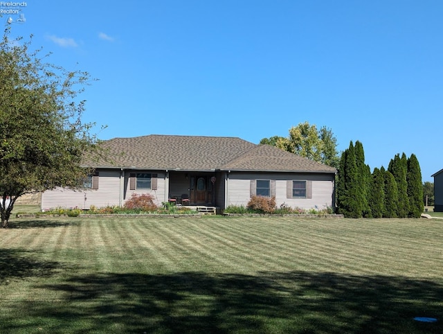 ranch-style house featuring a front lawn