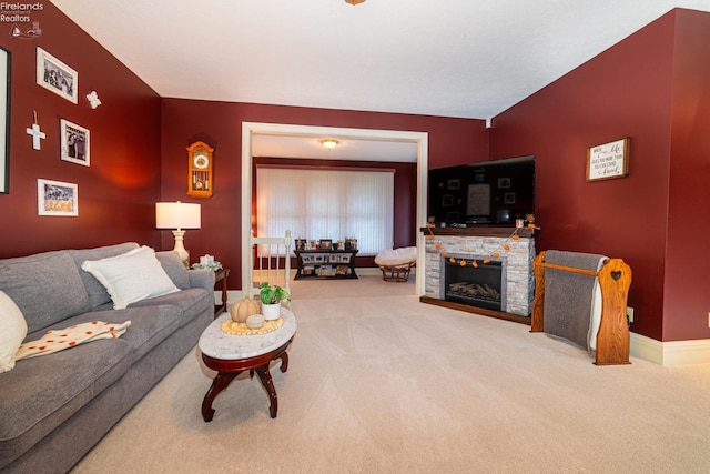 carpeted living room with a fireplace