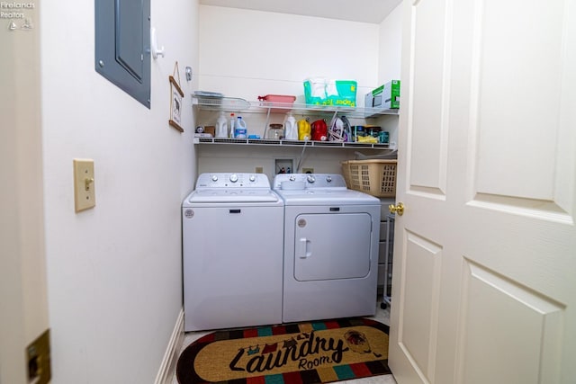 laundry area featuring washer and clothes dryer and electric panel