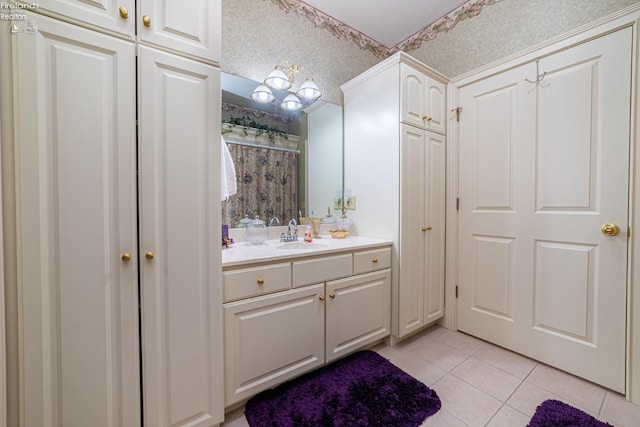 bathroom featuring a textured ceiling, vanity, and tile patterned floors