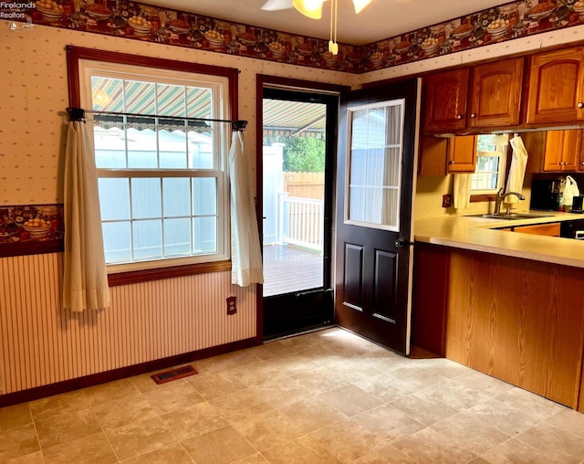 kitchen with ceiling fan and sink