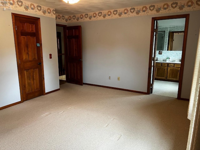 empty room with light colored carpet