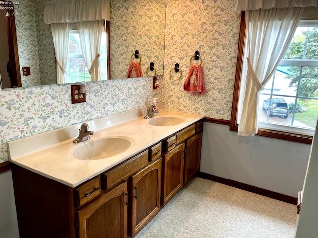 bathroom with vanity and a healthy amount of sunlight