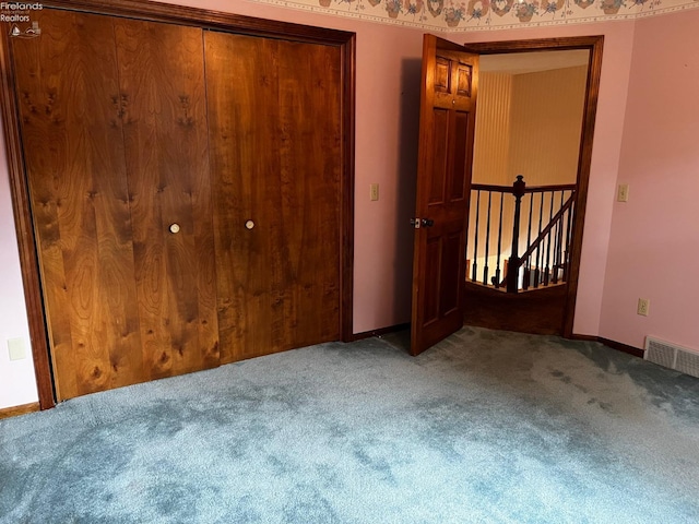 unfurnished bedroom featuring carpet flooring