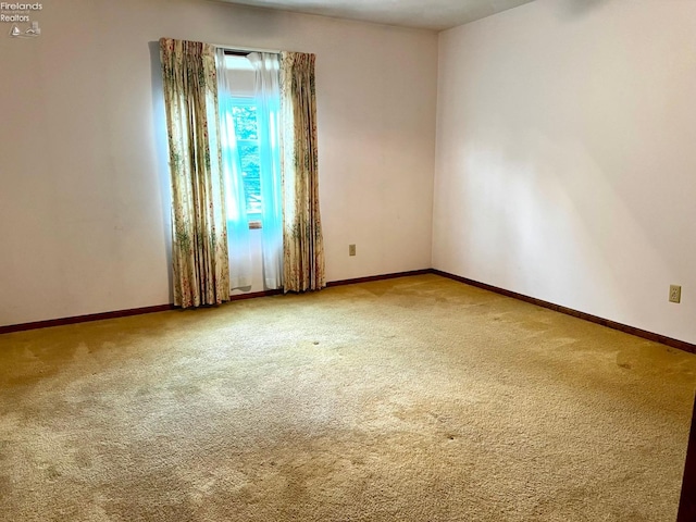 empty room with carpet flooring