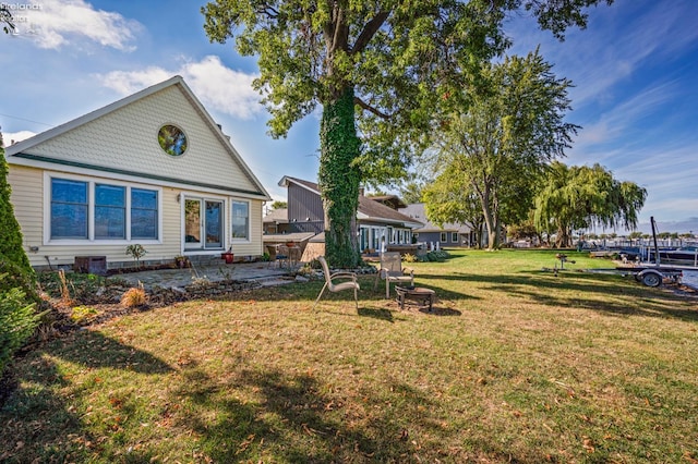 exterior space featuring a patio, central AC unit, and a yard