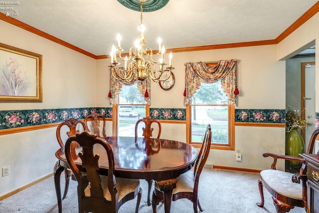 dining area with a textured ceiling, ornamental molding, and a notable chandelier