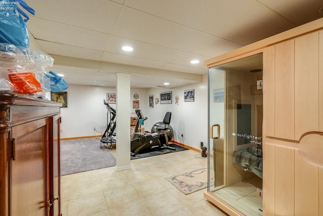 exercise area featuring tile patterned flooring