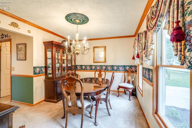 carpeted dining space with a textured ceiling, crown molding, and a notable chandelier