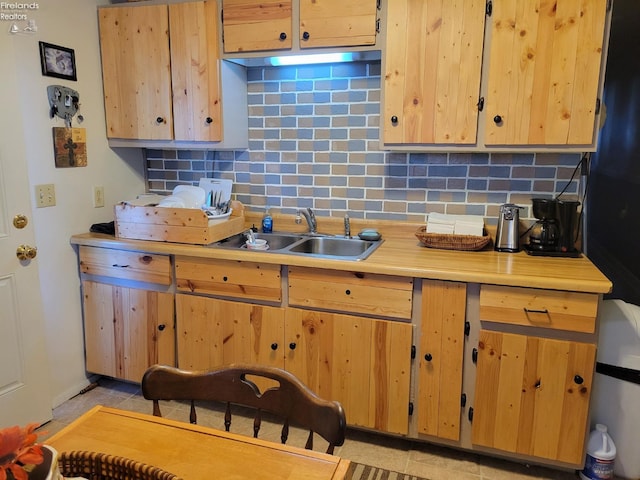 kitchen with tasteful backsplash and sink