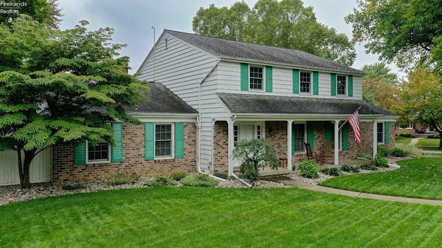 view of front of property featuring a porch and a front yard