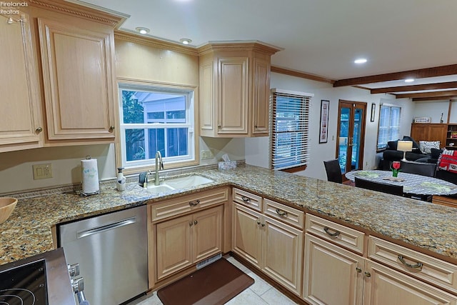 kitchen featuring light brown cabinetry, stainless steel dishwasher, sink, and beamed ceiling